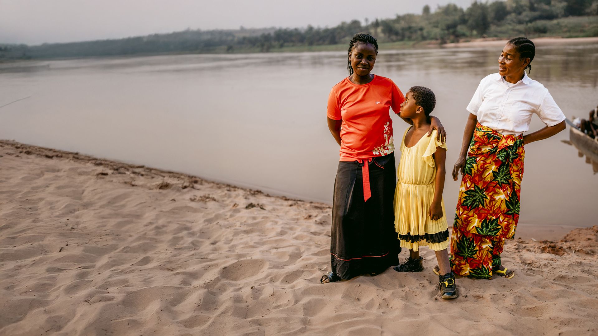 Chouchou*, 10, and Patience by the river in Kasai, DRC.