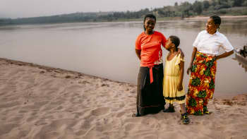 Chouchou*, 10, and Patience by the river in Kasai, DRC.