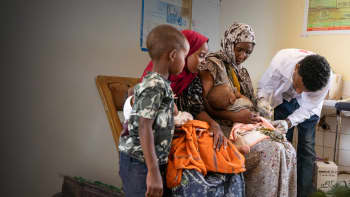 Health worker Worku, 26, prepares to vaccinate twins Hassan and Hussien at a Save the Children-supported health center in Ethiopia.