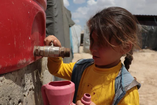 ch1586739-jihanes-daughter-zaina-6-fetching-water.aspx%3Fwidth%3D1200%26height%3D674%26ext%3D.jpg.webp