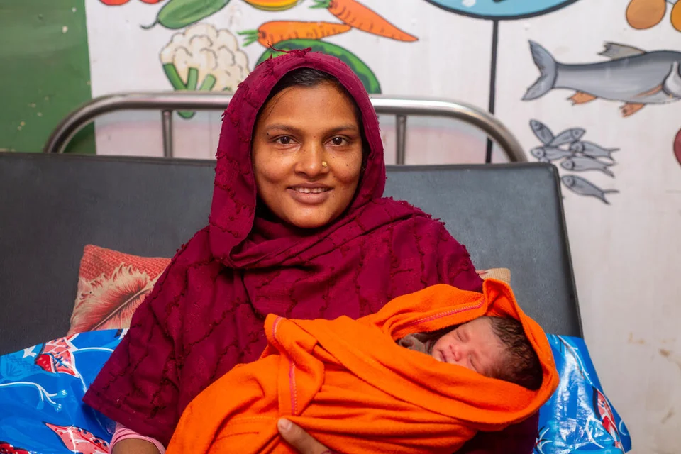 Asma en haar pasgeboren baby Kassem