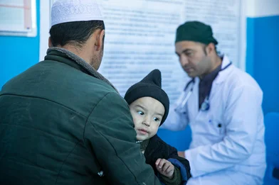 Rasool* with his son Yama* for a check-up during their visit to Dr. Hanif*
