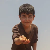 ch1563770-aysar-9-playing-with-stones-near-his-1