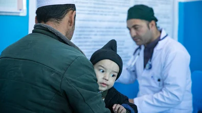 Rasool* with his son Yama* for a check-up during their visit to Dr. Hanif*